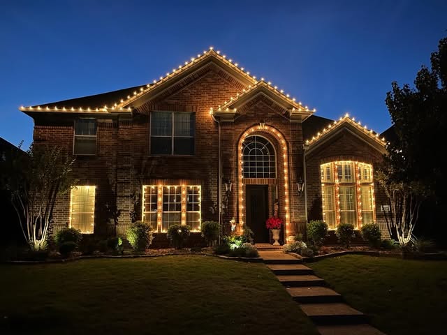 Christmas lights installed on a home